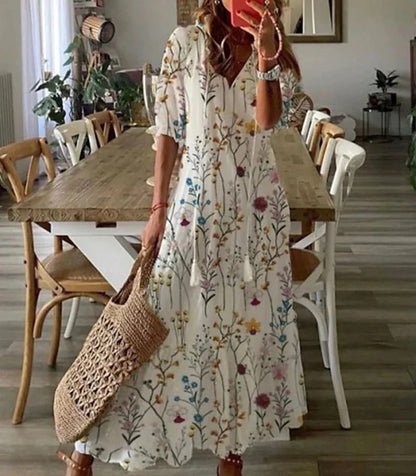 Robe femme élégante, coupe midi, motifs géométriques, manches bouffantes, pour un look estival.