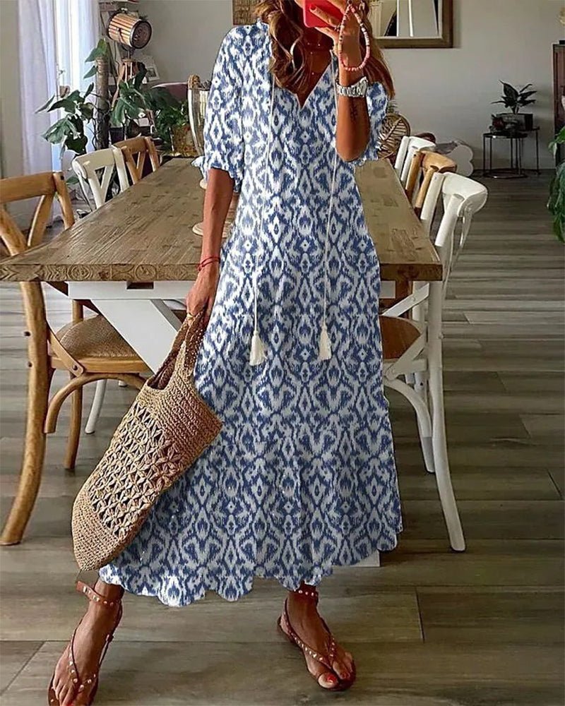 Élégance décontractée: robe longue femme, motifs géométriques, manches bouffantes, col en V.