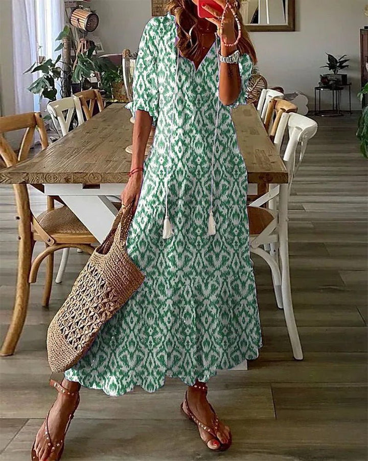Robe femme midi, imprimé géométrique, manches lanternes, style bohème chic, parfaite pour la saison.
