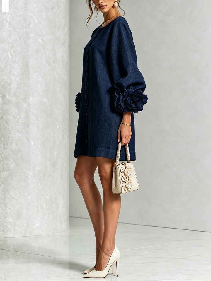 Robe d'été rose, coupe trapèze, manches trois-quarts, effet lin, pour un look frais et moderne.