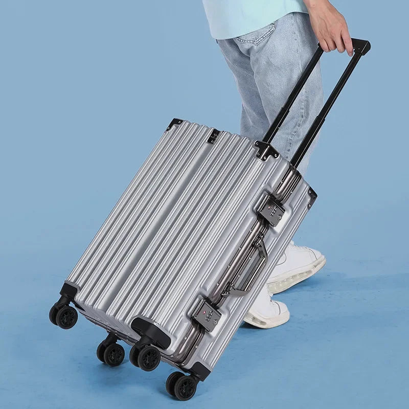 Valise de voyage rigide et robuste, roulante, pour hommes et femmes voyageurs.