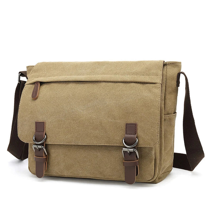 Sac bandoulière homme noir, toile robuste, parfait pour un usage quotidien ou en voyage organisé.