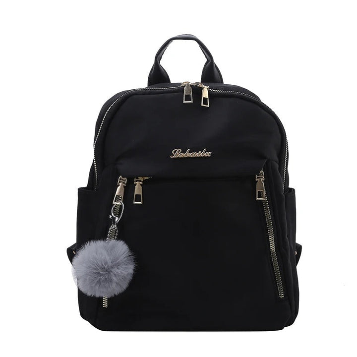 Sac à dos de voyage femme noir, spacieux et chic, accessoire mode essentiel pour vos déplacements.