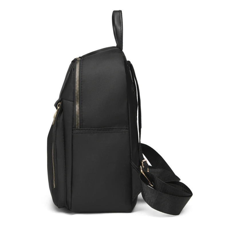 Sac à dos polyvalent noir femme, élégant et robuste, adapté au quotidien et aux aventures de voyage.