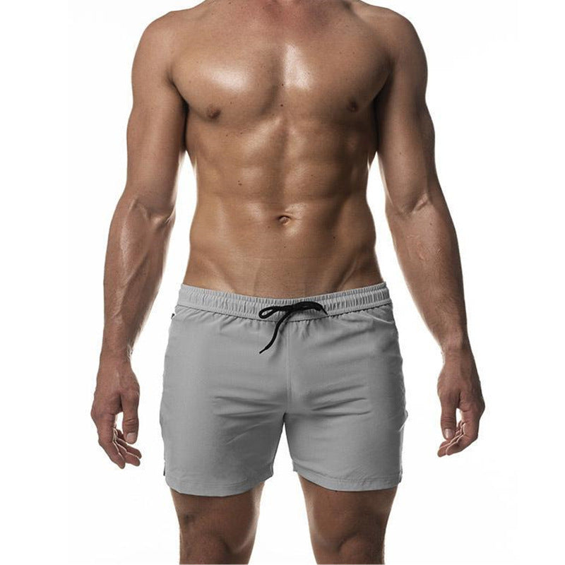 Short de bain homme polyvalent, parfait pour l'entraînement et les activités d'été. Tissu à séchage rapide et confortable.