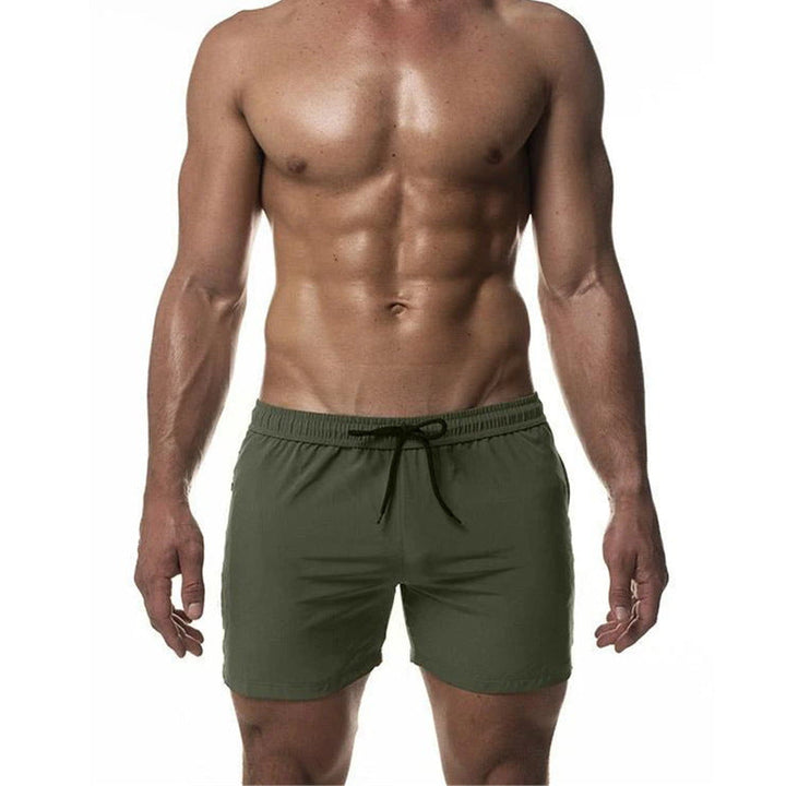 Short de bain pour homme, idéal pour l'entraînement de natation. Design sportif, séchage rapide et confort longue durée.