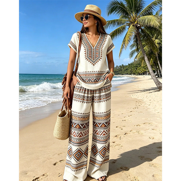 Tenue bohème chic : ensemble femme fluide avec haut floral et pantalon large pour un confort optimal.