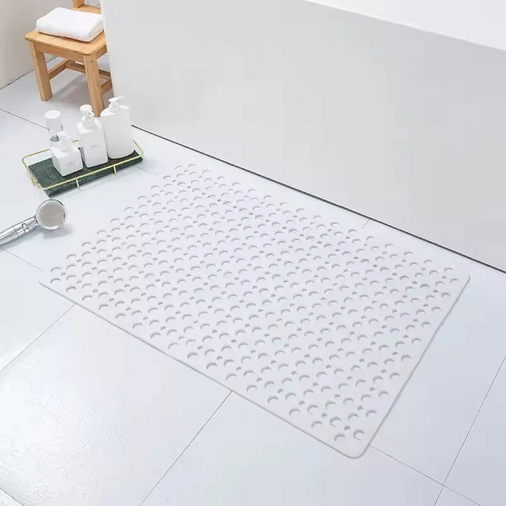 Accessoire de salle de bain : tapis de douche anti-glisse avec ventouses puissantes pour une fixation sécurisée et un bain sûr.