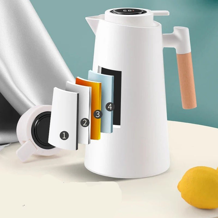 Élégante carafe thermique avec affichage température, poignée en bois, pour boissons chaudes/froides.