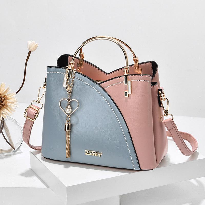 Sac fourre-tout en cuir pour femme, chic et moderne, doté d'une bandoulière, idéal pour une organisation élégante.
