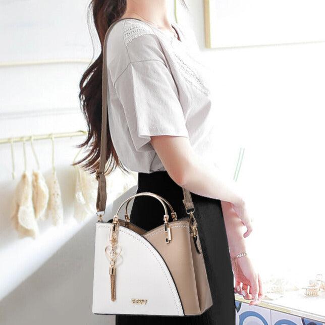 Sac fourre-tout en cuir luxe avec bandoulière amovible, chic et pratique pour femme moderne.