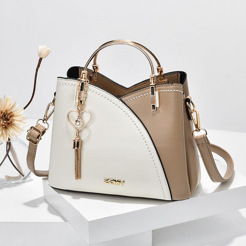 Élégant sac à main fourre-tout en cuir luxe pour femme, accessoire chic et moderne avec organisation.