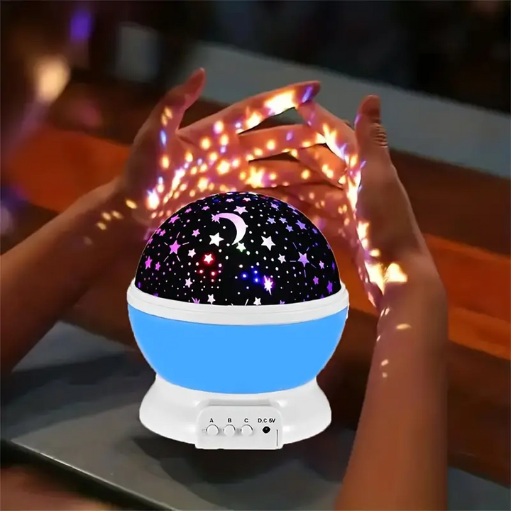 Veilleuse musicale pour bébé, projecteur d'étoiles multicolore, décor et ambiance lumineuse et sonore.