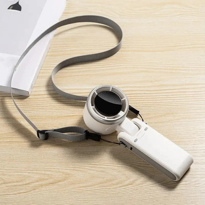 Mini ventilateur portable USB-C, rechargeable et pliable. Mode turbo et écran numérique pour l'été.