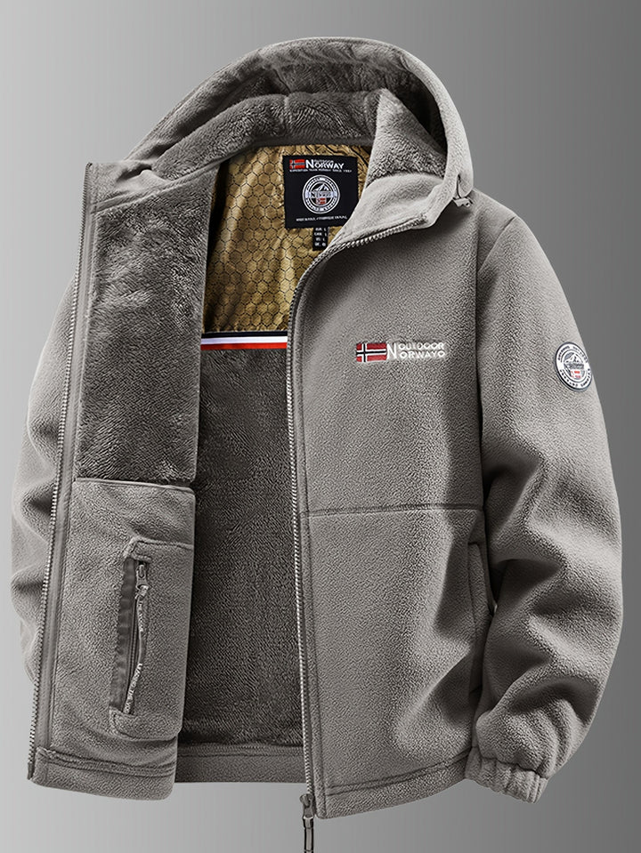 Veste homme polaire rouge, thermique et coupe-vent, avec capuche. Assure chaleur et confort en hiver ou en randonnée.