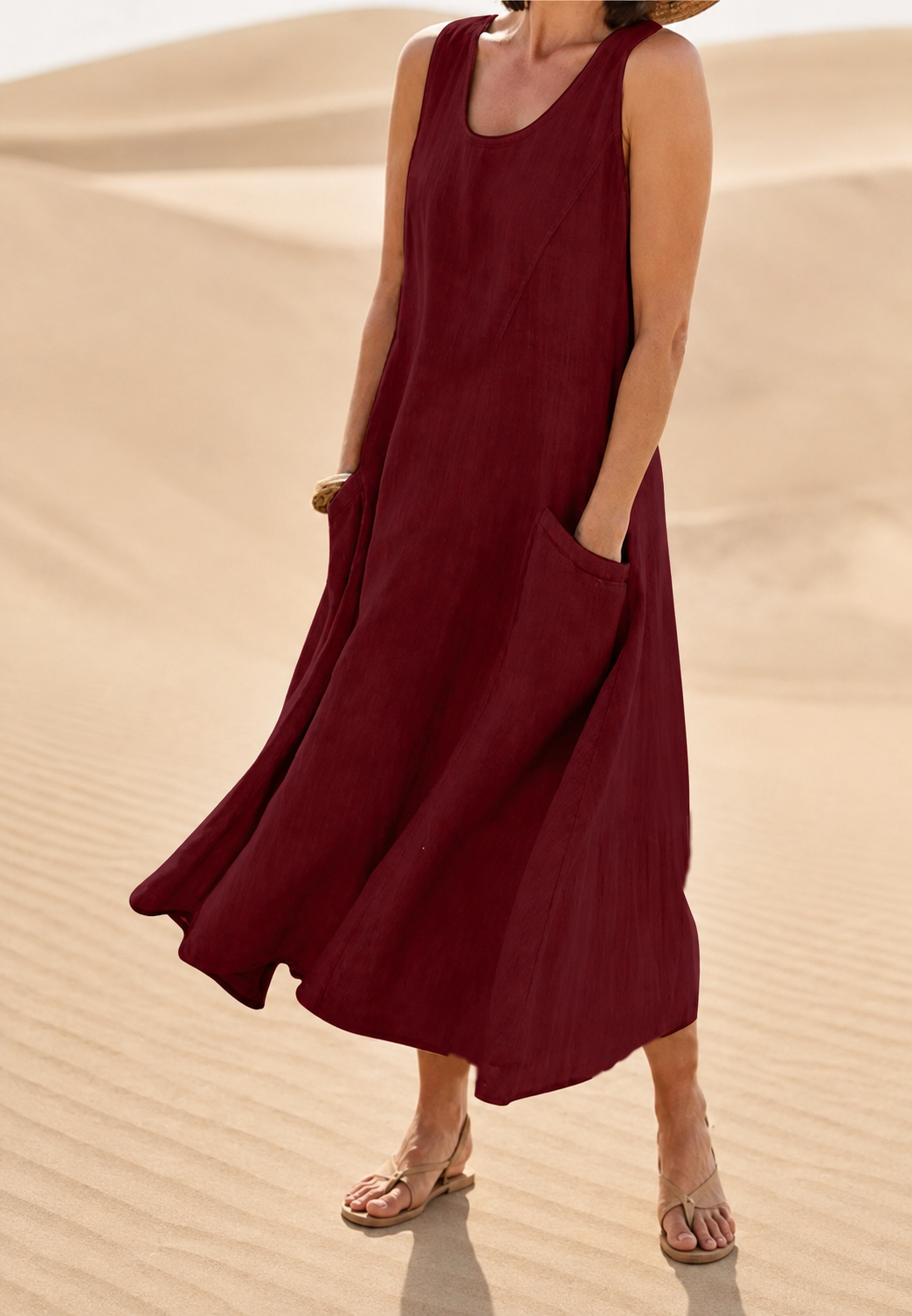 Robe longue femme sans manches, vêtement fluide confortable avec poches. Parfaite pour les journées d'été.