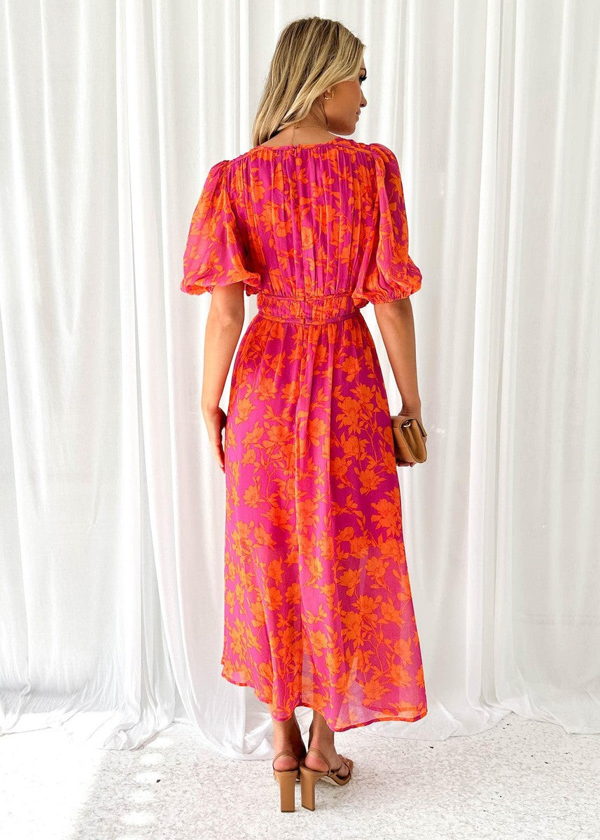 Robe midi femme à imprimé floral, coupe fluide et col en V, dotée de manches bouffantes pour un look estival décontracté.