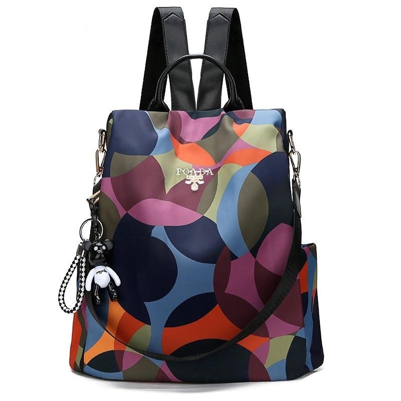 Sac à dos anti-vol élégant pour femme, couleur unie, résistant à l'eau, idéal voyage et quotidien urbain.
