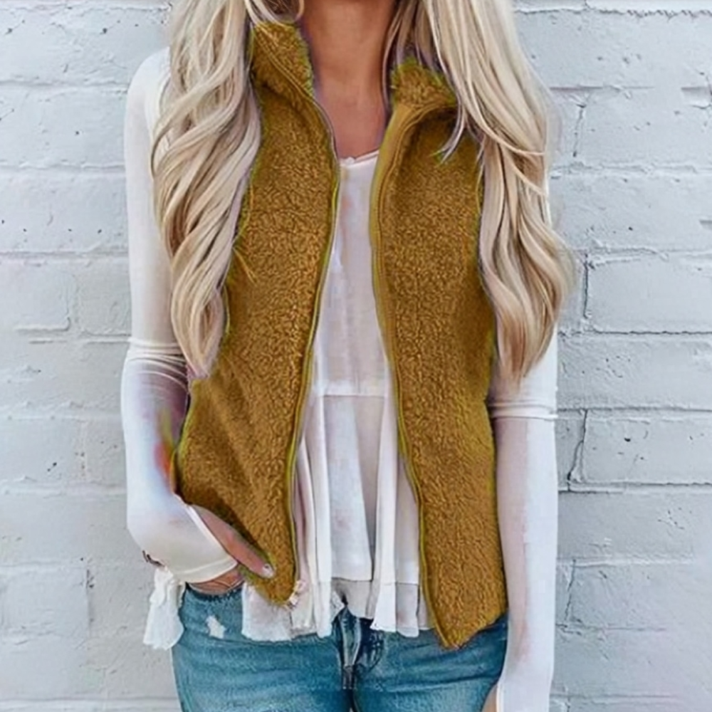 Veste gilet femme teddy élégante couleur unie, à zip. Idéale pour un look casual chic et confortable en hiver.