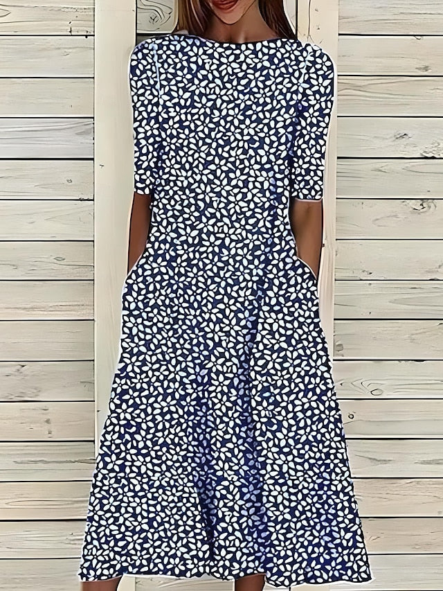 Vetement femme: robe midi fleurie en coton doux, motif floral. Robe d'été confortable avec col rond et manches courtes.
